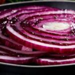 How can I come more healthy by eating raw onions?