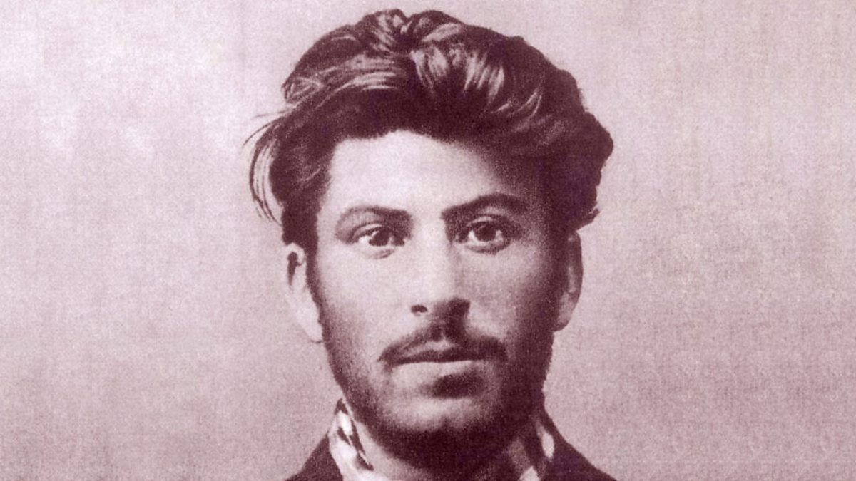 What were the reasons why Russians continued to praise Stalin even after he was no longer in power?