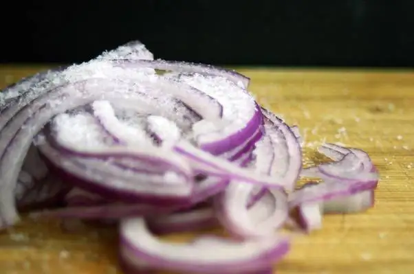 Does eating lots of raw onions with salad beneficial to health?